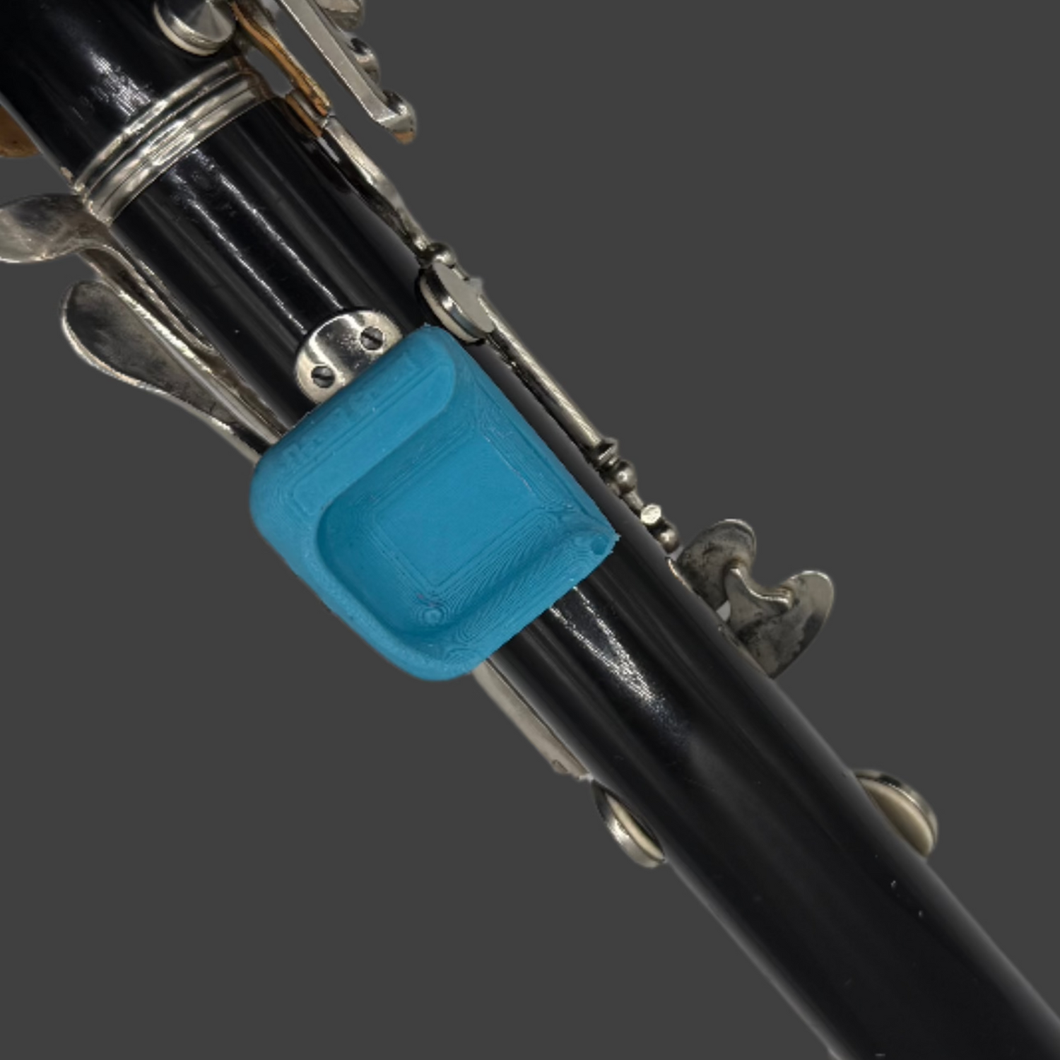 Clarinet and oboe thumb rest support tool – beginner training aid